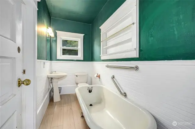 Updated bathroom with new vanity and vinyl plank flooring.