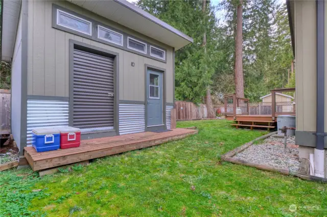 196 square foot custom built shed with metal roof, roll down door and windows.