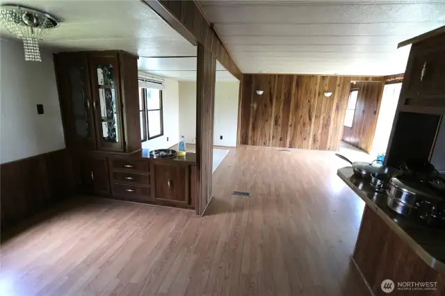 Dining room includes a built-in hutch, perfect for display and extra storage.