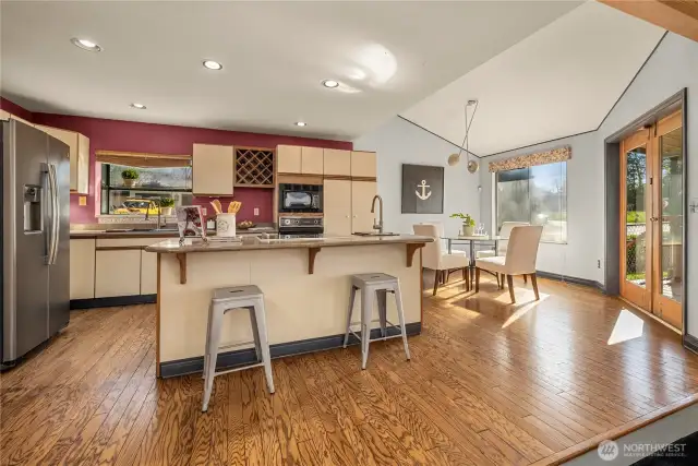 Beautiful hardwood floors offer easy maintenance for the kitchen, eating area and walkways.