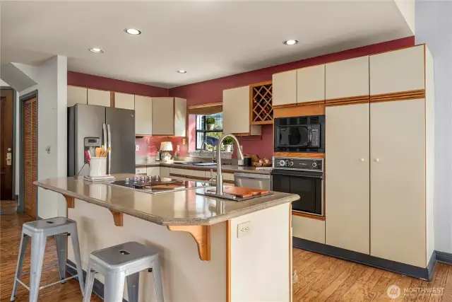 There is plenty of cabinet and counter space.  Enjoy the breakfast bar or just gather for conversational cooking.