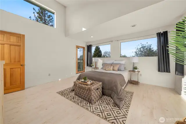 The primary suite is upstairs with private ensuite, walk in closet and deck with Puget Sound views.