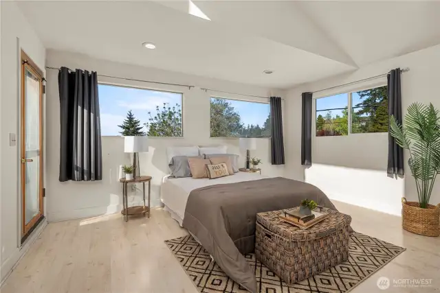Ideas abound....add a larger deck and sliding glass doors to capture and celebrate the unobstructed Puget Sound view from this room.