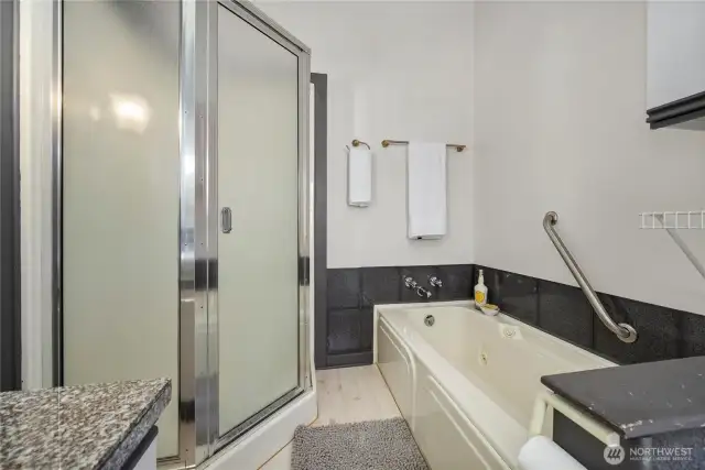 The primary bath has a separate shower and a jetted soaking tub.
