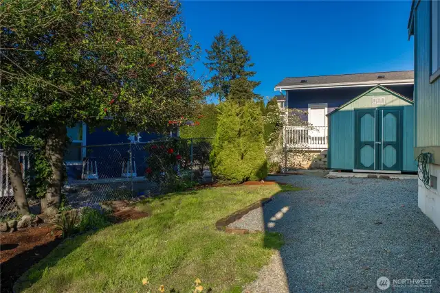 The quarter acre lot offers abundant gardening and storage space.