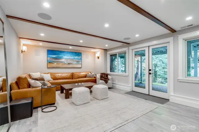 Media room with built-in speakers and french doors opening to the back yard. Watching football has never been so fun!