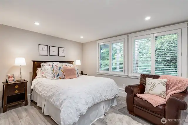 Lower level bedroom with wonderful windows opening to the back garden.