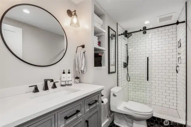 Lower level bathroom with walk-in shower.