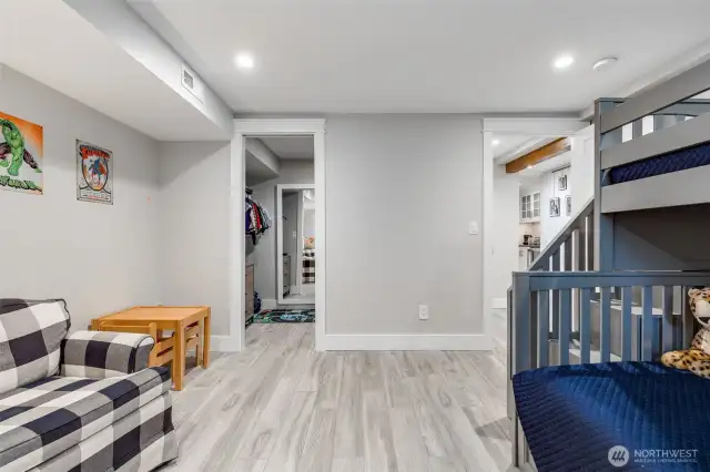Walk in closet and a super fun secret playroom behind the sliding mirror!