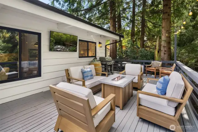 Unwind on your private deck overlooking a tranquil backyard sanctuary—listen to the gentle creek and enjoy true tranquility at home.