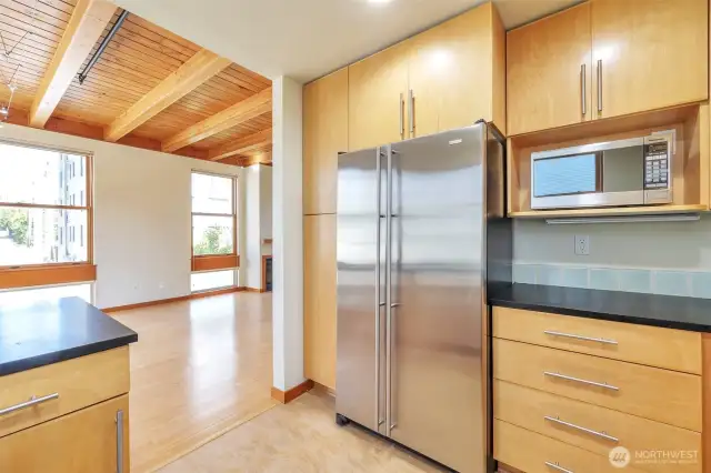Open kitchen design connects the kitchen to the main living area providing a spacious and social feel.