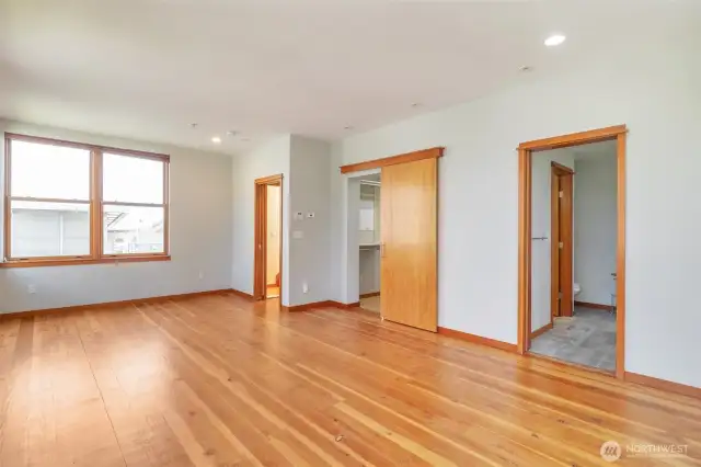The primary bedroom suite is spacious enough to accommodate a sitting area and features a 5 piece bath, walk-in closet area and in-suite stacked washer/dryer.