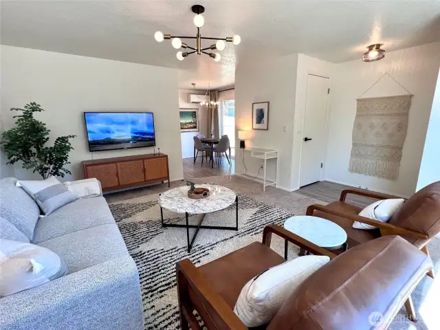 01 unit living room towards dining area and sliders to side yard