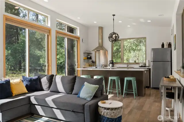 Spacious center island with breakfast bar seating—perfect for morning coffee or casual meals with a view.
