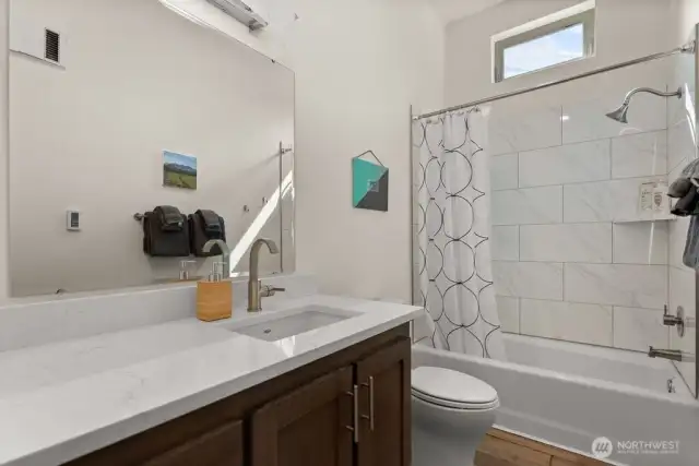 Main bathroom; full bathroom with elegant tilework – Clean lines and energy-efficient fixtures in both baths.