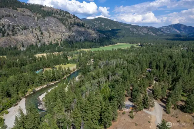 Aerial view of Mazama Meadows community showing riverfront, open space, and trail corridor.