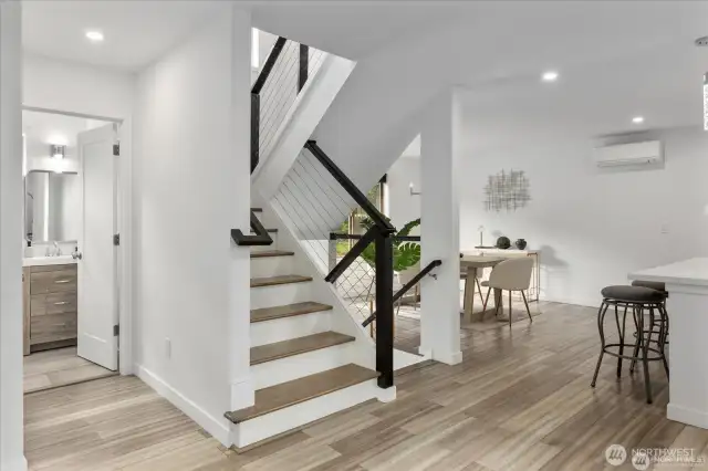 Custom railings accentuate the stairwell.