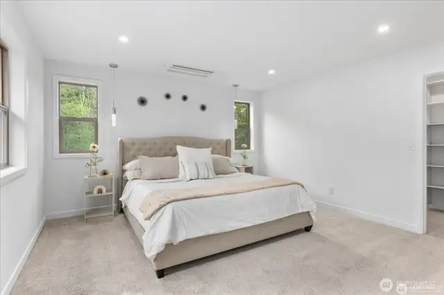 The primary suite is spacious and inviting.