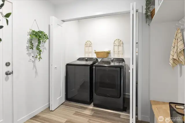 The laundry area with generous storage and folding area.