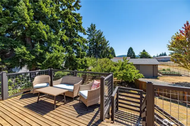 Spacious deck over looking the back yard and shop