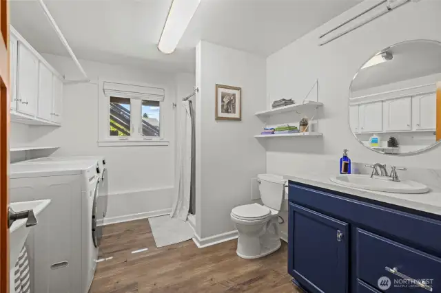 Lower level laundry room with 3/4 bathroom