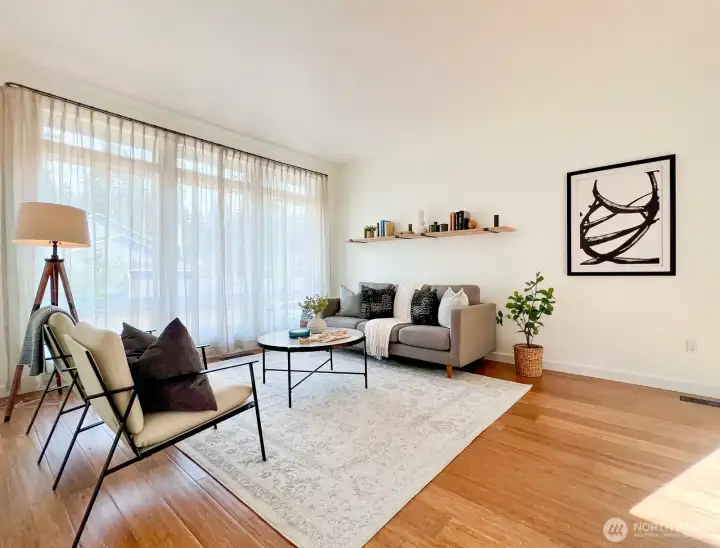 Living room with floor to ceiling windows.