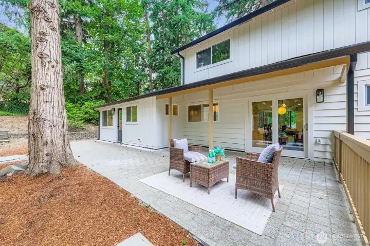 Hardscape patio carries from dining area to breakfast nook