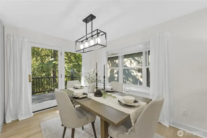 Dining area with double doors to deck