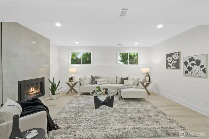 Bonus room with gorgeous cozy gas fireplace. Lower level