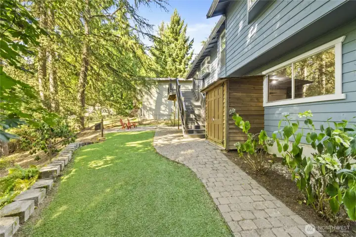 Back of home with storage shed