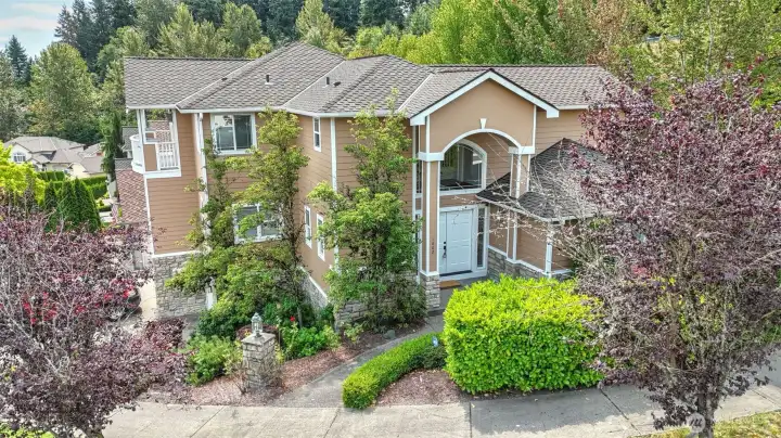 Discover this exquisite multi-level home, perfectly situated on a corner lot in a desirable Auburn neighborhood. The inviting layout features bright, open living spaces filled w/natural light, creating a warm & welcoming atmosphere. A thoughtfully designed kitchen offers ample cabinetry, modern finishes & a seamless flow to the living rm—ideal for entertaining. Upstairs boasts a spacious primary w/en suite, plus 3 guest rooms. Enjoy a main floor office/flex space, and a lower level featuring a large bonus room, guest bath, storage/kitchenette space with wine rack. Endless opportunities w/this spacious layout! Conveniently located near parks, schools, shopping, & major commuter routes, this home combines comfort w/unbeatable accessibility.