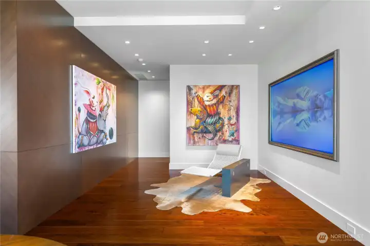 What a gallery! Noticed the diamond pattern on the book-matched walnut panels. Relax and enjoy your physical and digital artwork (currently displaying Blackdove digital canvas art) on 98" commercial display.