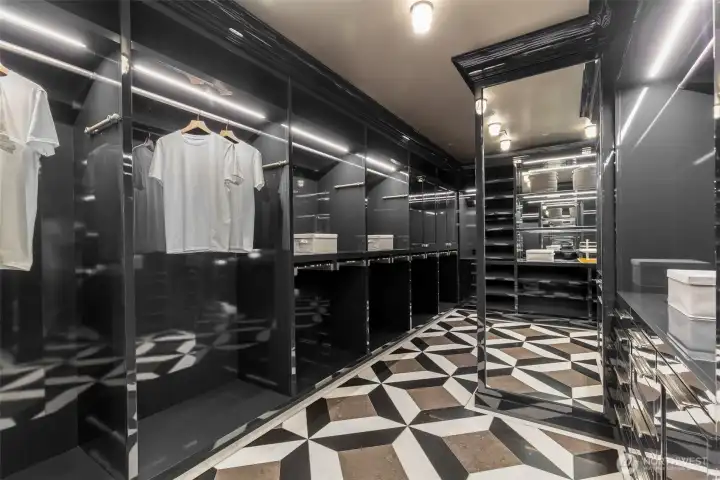 If we had more spaces for photos, we would show the back half of this massive dressing room. How many gowns, handbags, kicks, watches, etc. could you store here, under the classic art-deco fixtures? Let's find out.