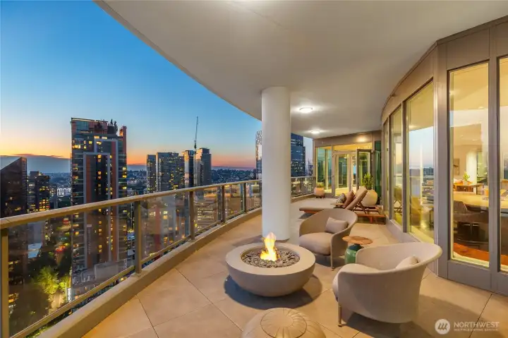 This terrace has space for various seating; around the firepit, on the lounge, etc.