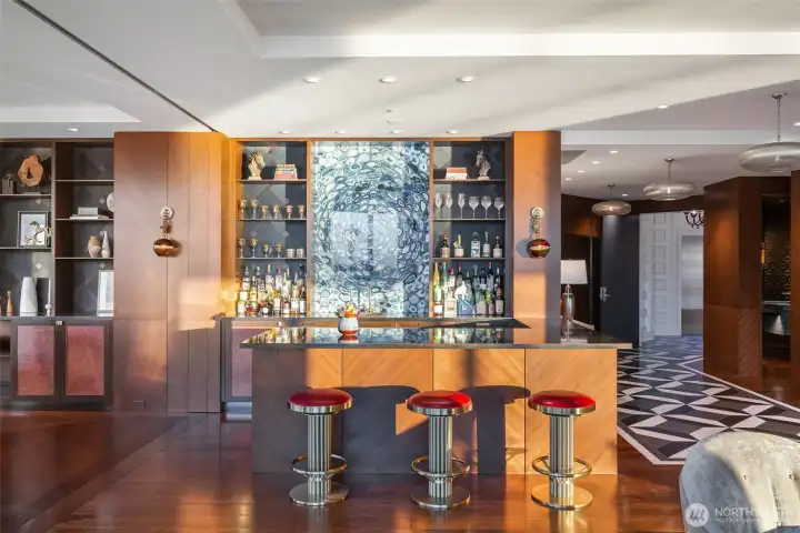 Whether slinging cocktails or mocktails, full-octane or N/A, this space is so cool. Backlit sliced agate draws them in. Keleen Leathers cabinet insets and shelf backing keep things interesting. Sub-Zero beverage drawers, Fisher & Paykel dishwasher draws, wine cooler, ice maker and Harriett Industries custom antique brass wrapped countertops.
