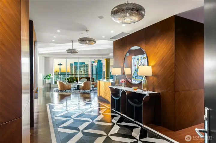 More Ann Sacks honed custom-mosaic marble tile; this under beautiful light fixtures setting the perfect mood.