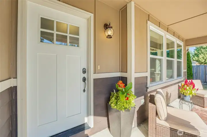 Catch some south facing sun rays on the front porch! Charming curb appeal and thoughtful upgrades throughout—your new home awaits!