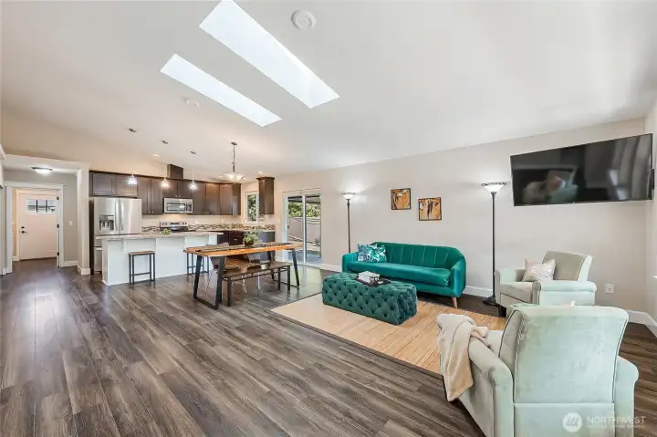 Vaulted ceiling and 2 skylights brightens the living/dining/kitchen area beautifully!