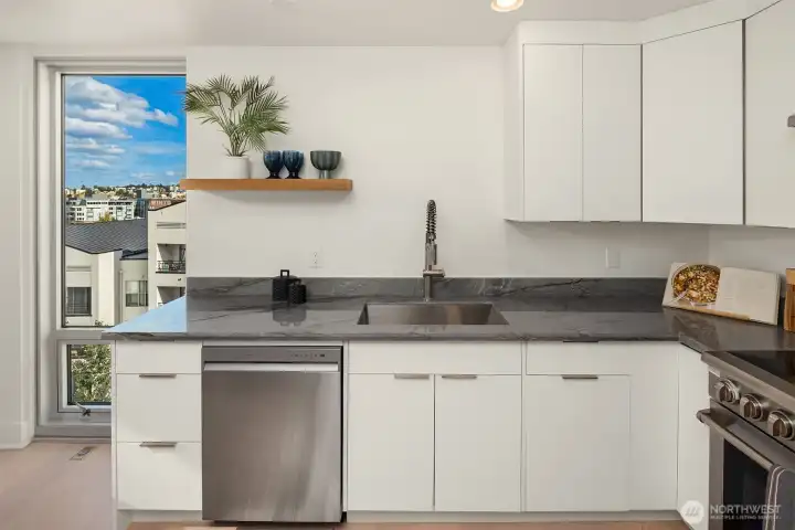 Sweet views from floor-to-ceiling kitchen/dining room toward the east (sunrises!)