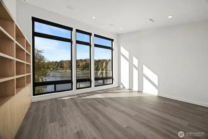 This room is very spacious with tall ceilings as well, and has incredible lake views. It can also have furniture for sleeping and be a dual use room.