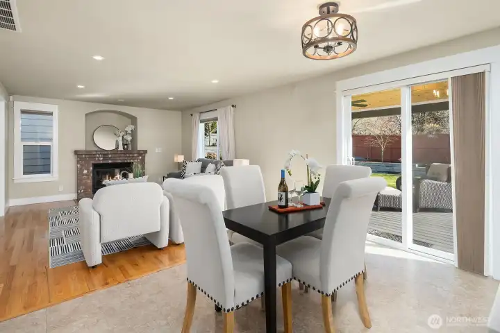 Another view of informal dining, family room, and deck