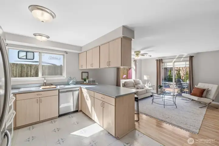 Open kitchen with breakfast bar. New dishwasher.