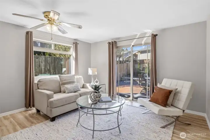 Family room could be used as a formal dining table space. Inviting family room or dining space that flows seamlessly to the peaceful backyard.