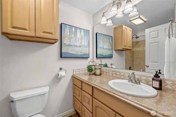 Full bath off main hallway for the two bedrooms and your guests.