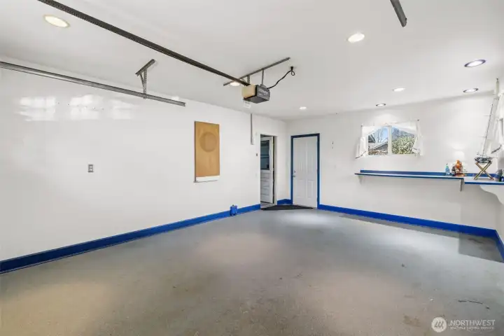 Heated hobby space  providing exceptional storage or use as your third garage bay. Door to back yard.