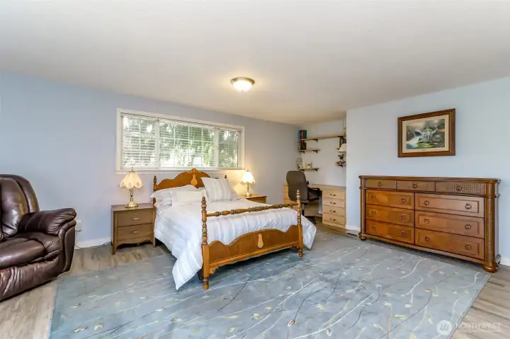 The large primary bedroom with walk in closet