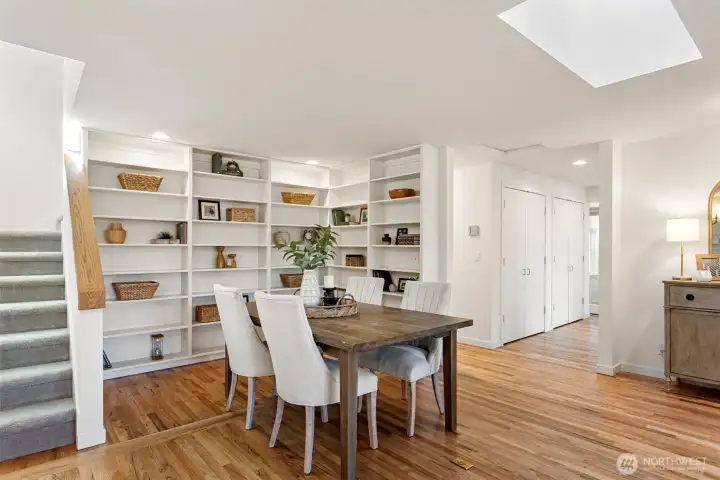 Dining area - Currently situated in this extended room which was once the original 3rd bedroom, this space could serve as a dining area or a reading nook, music room or just another space to gather. Accented by bookcases to feature and highlight the functionality of this flex space.