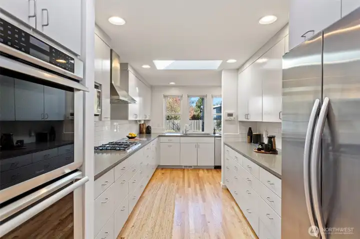 2010 Chefs kitchen with an abundance of cabinets, pull-outs, quartz counters and even a dedicated knife area to hide your sharpest but still have them handy. Stainless appliances included Frigidaire dishwasher, Thermador double oven, GE Monogram microwave, Bosch cooktop, Elkay overhead exhaust hood and KitchenAid side-by-side fridge-freezer.
