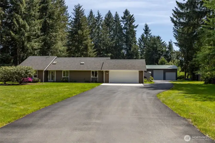Fully paved driveway that leads to shop.