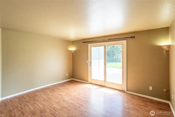 Primary has doors opening onto patio.